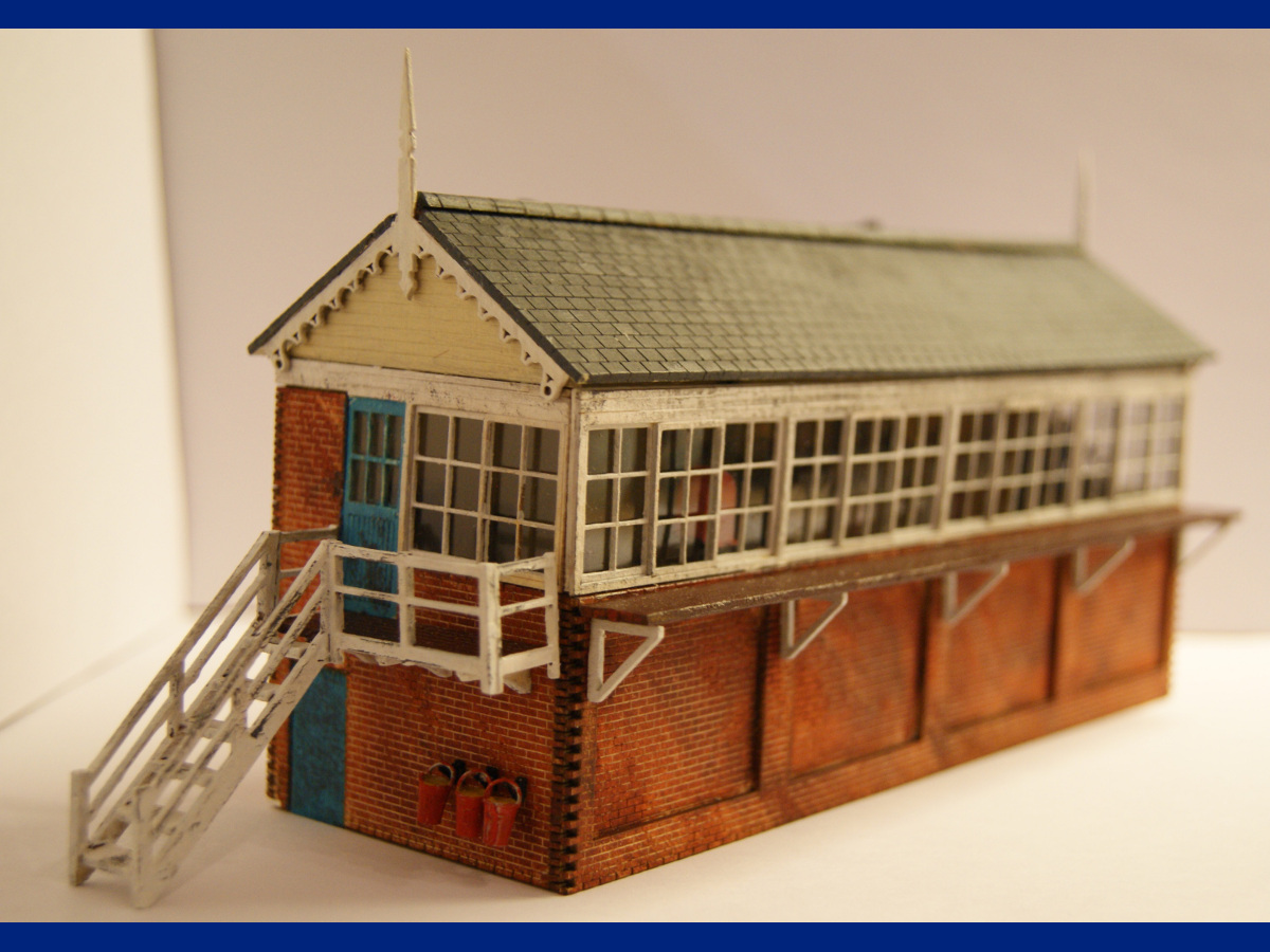 Another beautifully assembled and painted signal box by Claire and Martin. Modifications include the interior of the signal box and the front bottom windows blanked off.