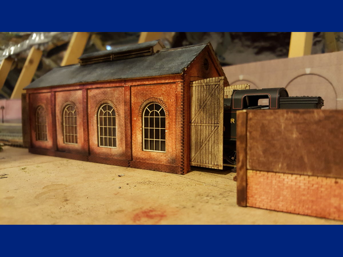 "This engine shed took just over a week to complete I love the way brick work come together I use acrylic paint and black weathering powder, windows I use acetate for the glazing and weather them with black weathering powder,  glue is PVA did try super glue but would not recommend it."